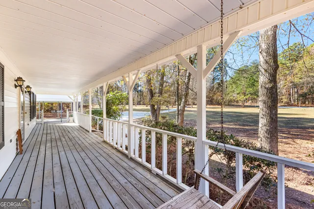 a view of balcony with wooden floor