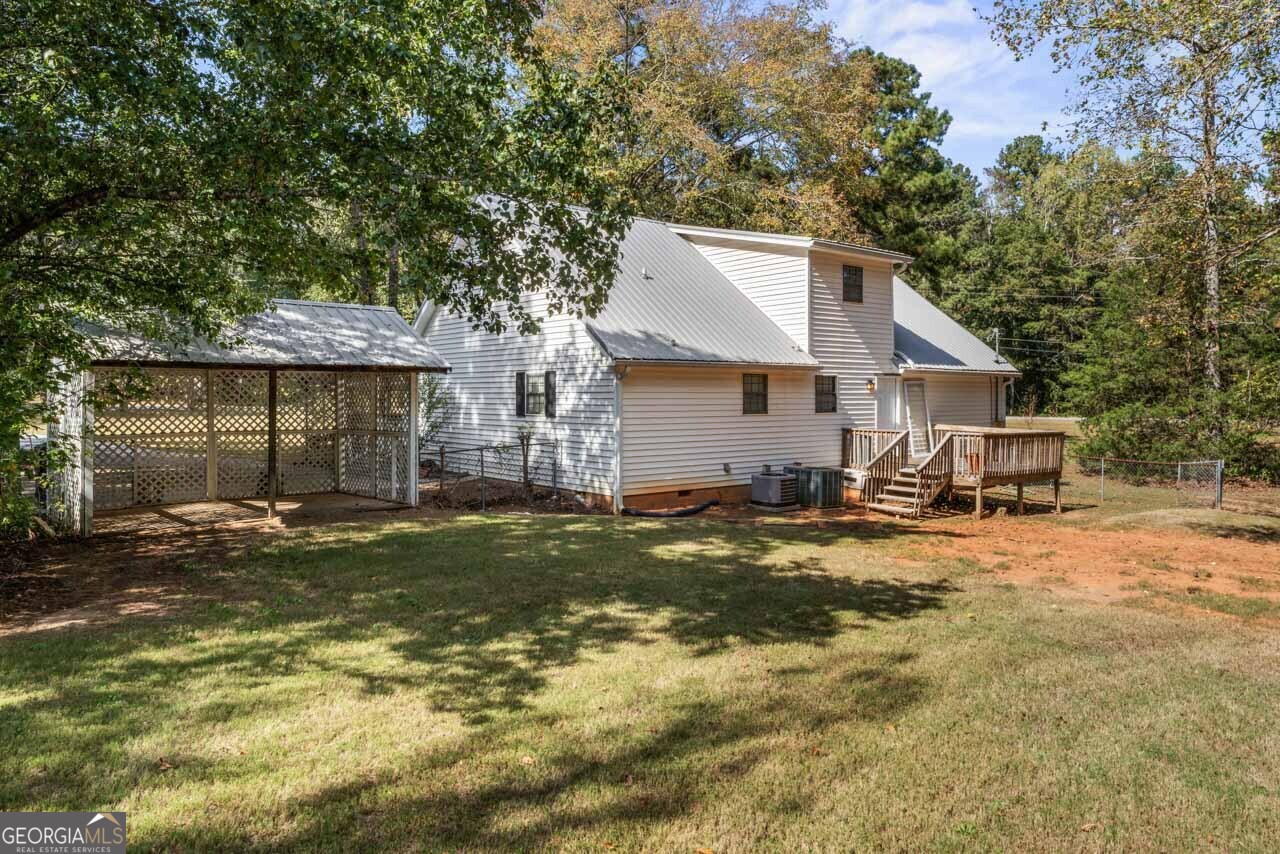 75 Antioch Road McDonough, GA 30252 - Photo 35 of 40 a view of a house with a yard and sitting area