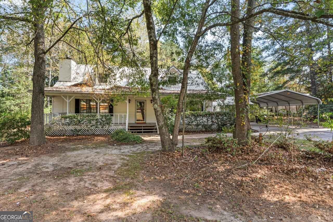 75 Antioch Road McDonough, GA 30252 - Photo 37 of 40 a view of a house with backyard and a tree