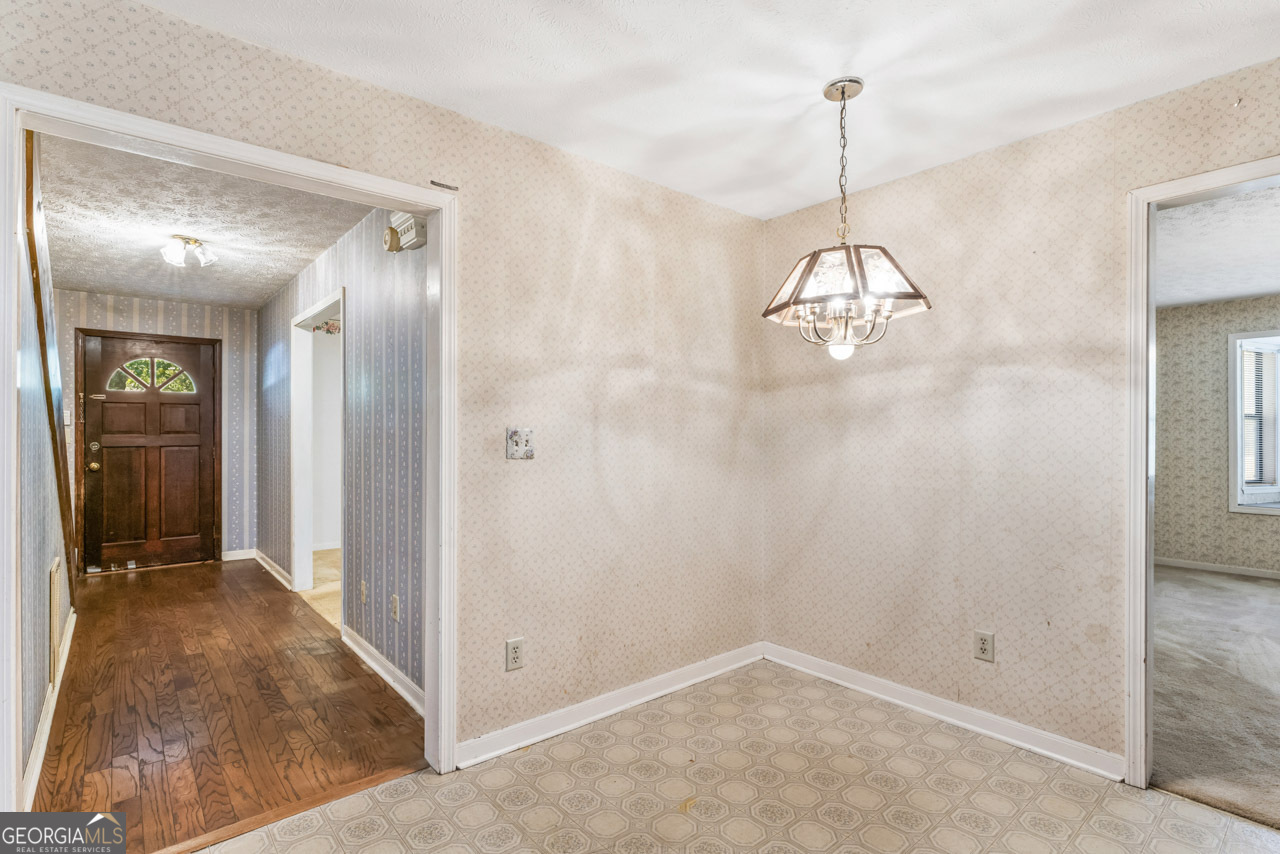 75 Antioch Road McDonough, GA 30252 - Photo 7 of 40 a view of a hallway with chandelier and entryway