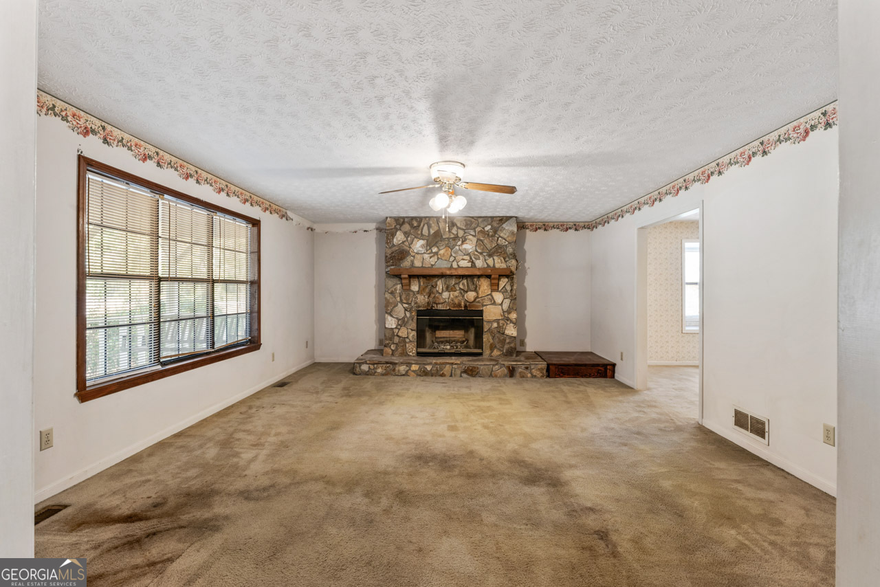 75 Antioch Road McDonough, GA 30252 - Photo 9 of 40 a view of an empty room with a window