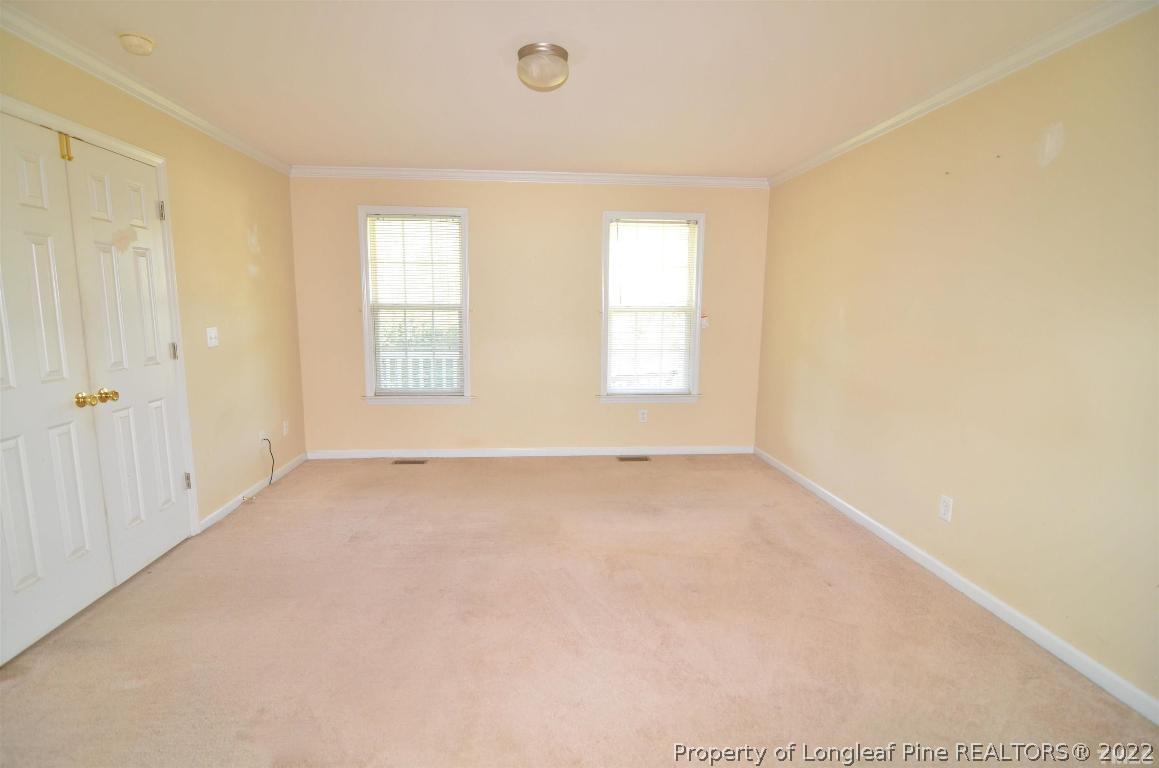 75 Natalie Drive Raleigh, NC 27603 - Photo 16 of 24 an empty room with windows