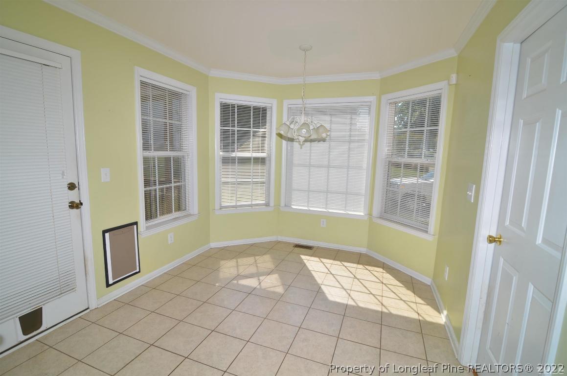 75 Natalie Drive Raleigh, NC 27603 - Photo 19 of 24 a view of an empty room with windows