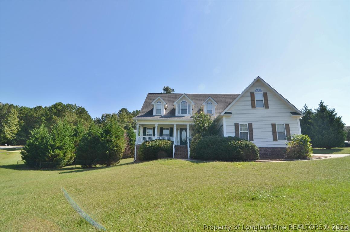 75 Natalie Drive Raleigh, NC 27603 - Photo 2 of 24 a front view of a house with a yard and trees