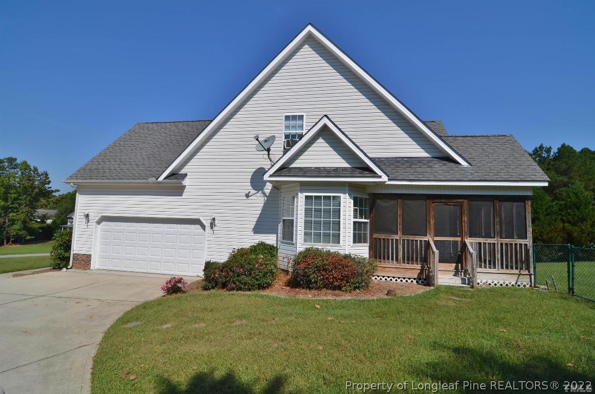 75 Natalie Drive Raleigh, NC 27603 - Photo 3 of 24 a front view of a house with a yard