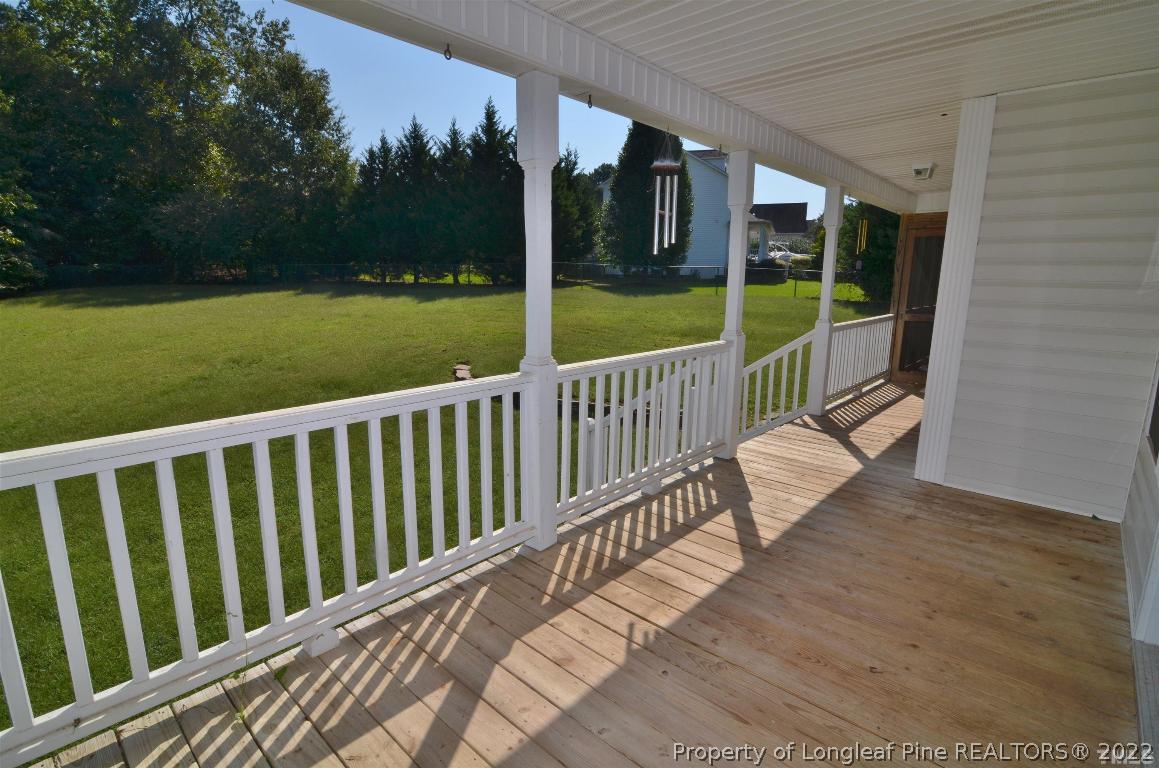 75 Natalie Drive Raleigh, NC 27603 - Photo 6 of 24 a view of balcony with floor to ceiling window and wooden fence
