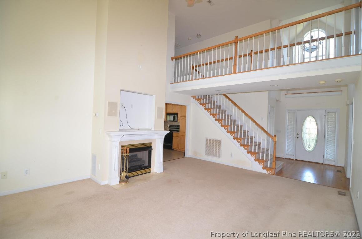 75 Natalie Drive Raleigh, NC 27603 - Photo 8 of 24 a view of an entryway with a fireplace