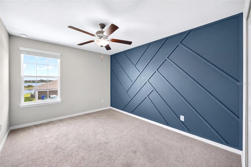 31724 Sun Kettle Loop Wesley Chapel, FL 33545 - Photo 17 of 49 an empty room with windows and fan