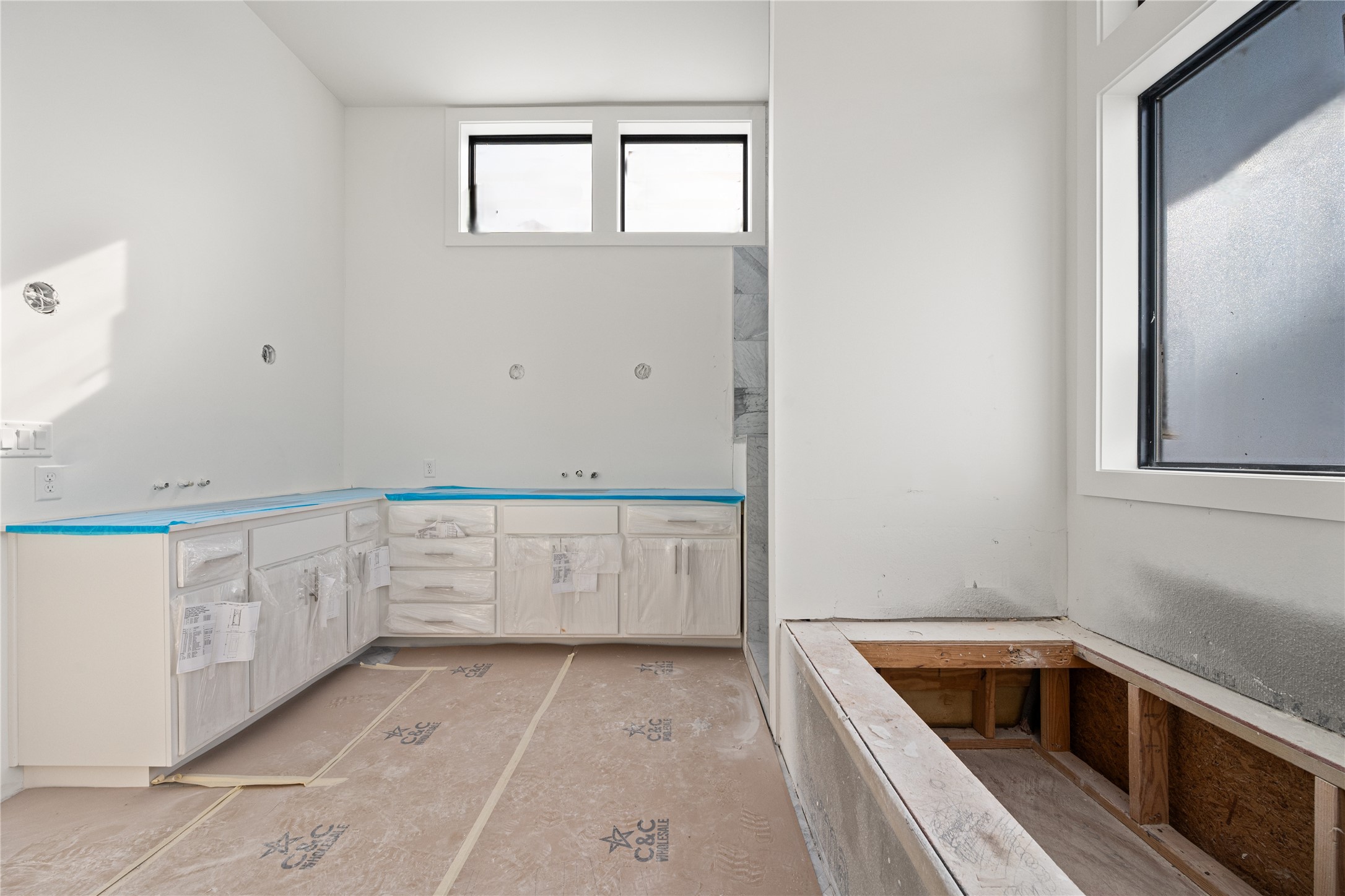 1406 West 9th Street, Unit 802 Austin, TX 78703 - Photo 11 of 17 a kitchen with granite countertop white cabinets and white appliances