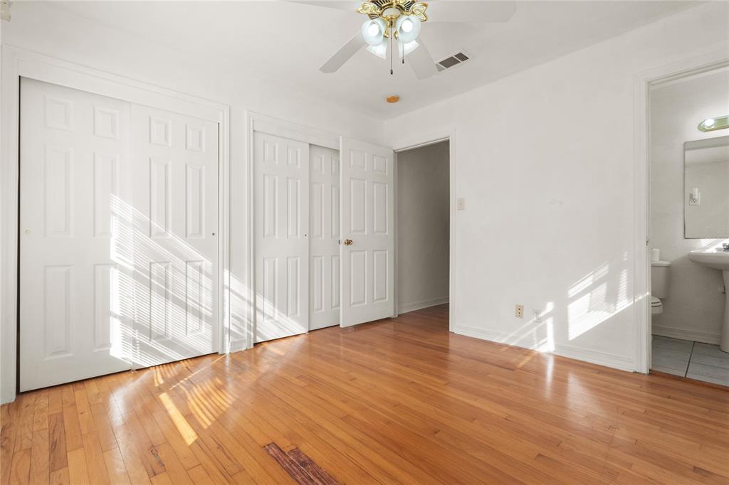 4805 Ira Street Haltom City, TX 76117 - Photo 9 of 16 a view of an empty room with wooden floor and a window