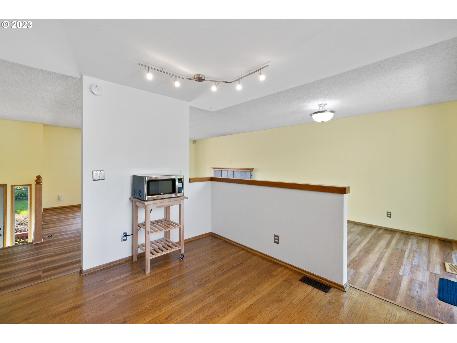1757 Southwest 19th Court Gresham, OR 97080 - Photo 11 of 31 a view of empty room with wooden floor