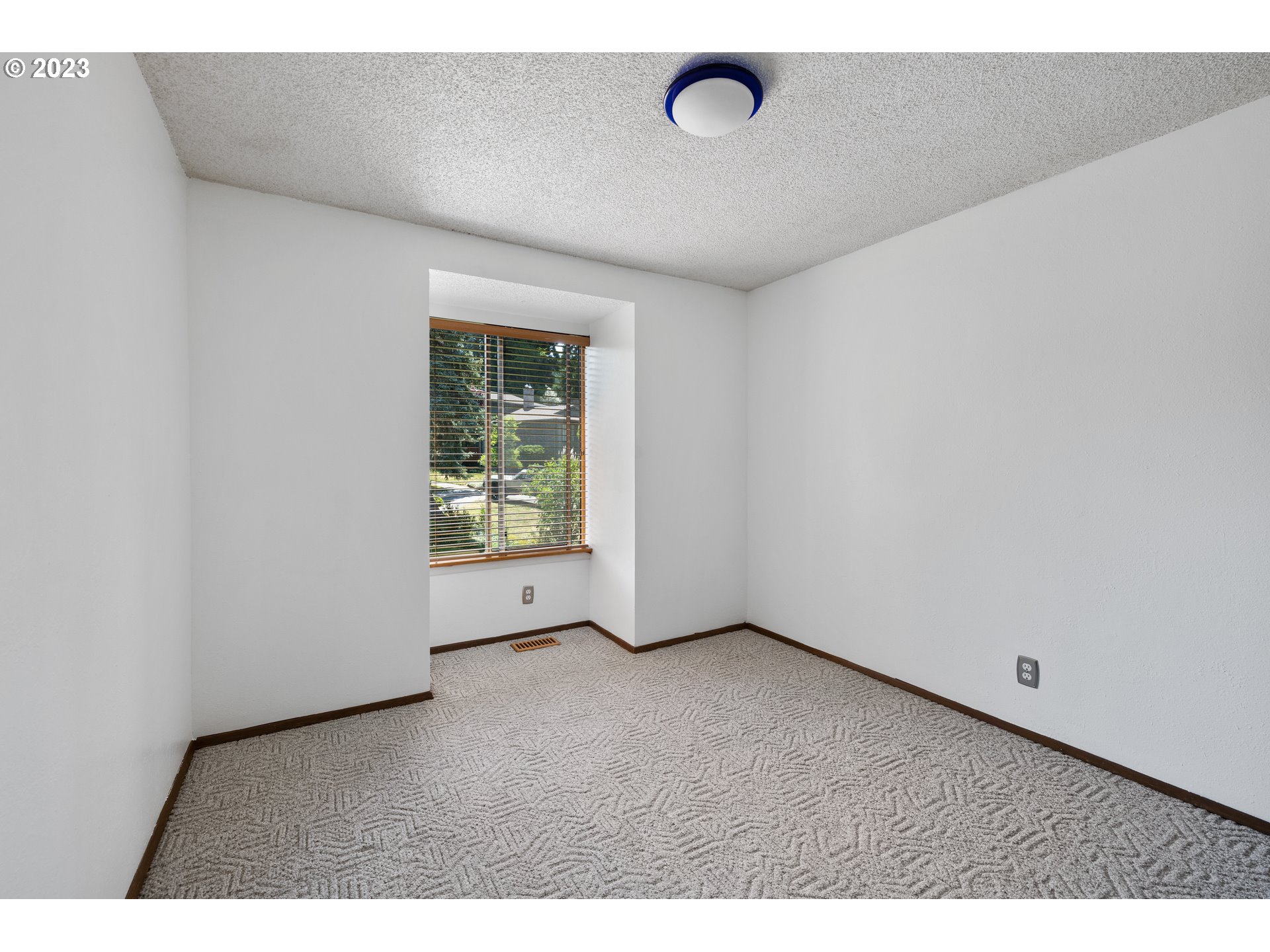 1757 Southwest 19th Court Gresham, OR 97080 - Photo 17 of 31 a view of an empty room with a window
