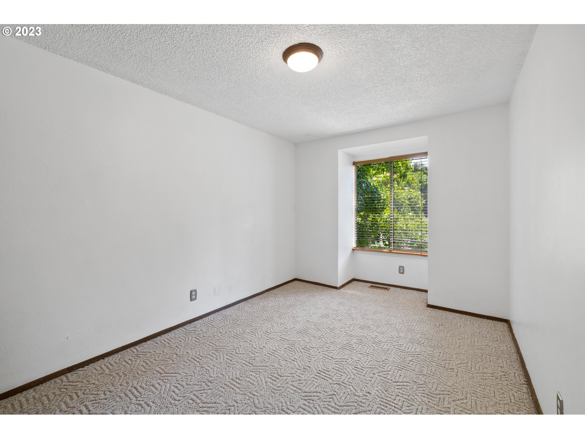 1757 Southwest 19th Court Gresham, OR 97080 - Photo 19 of 31 a view of an empty room with a window