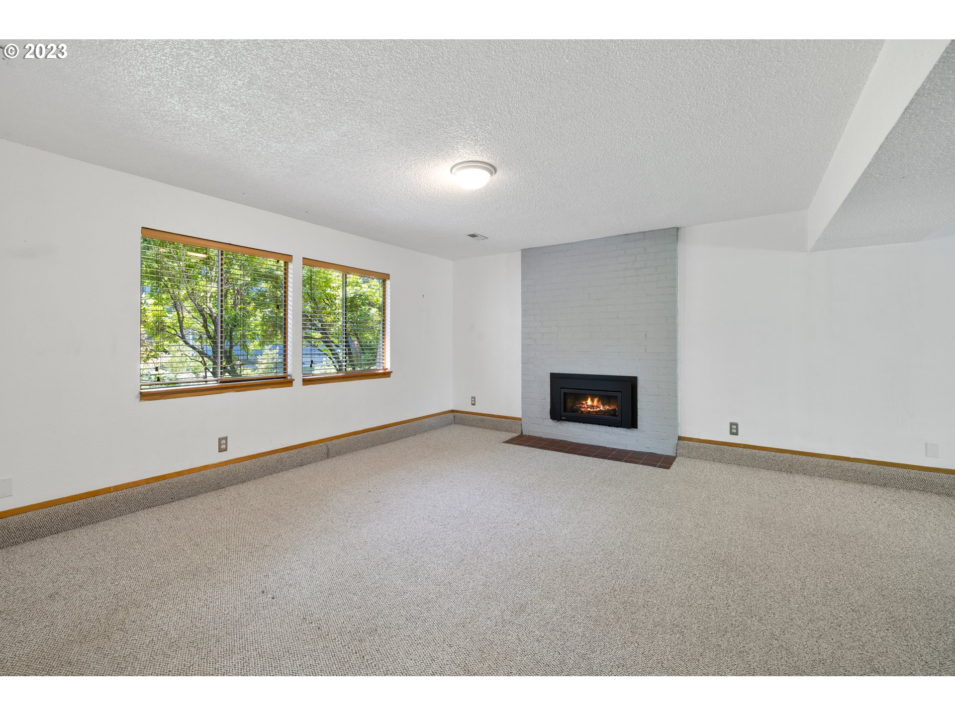 1757 Southwest 19th Court Gresham, OR 97080 - Photo 22 of 31 a view of an empty room with a window and fireplace