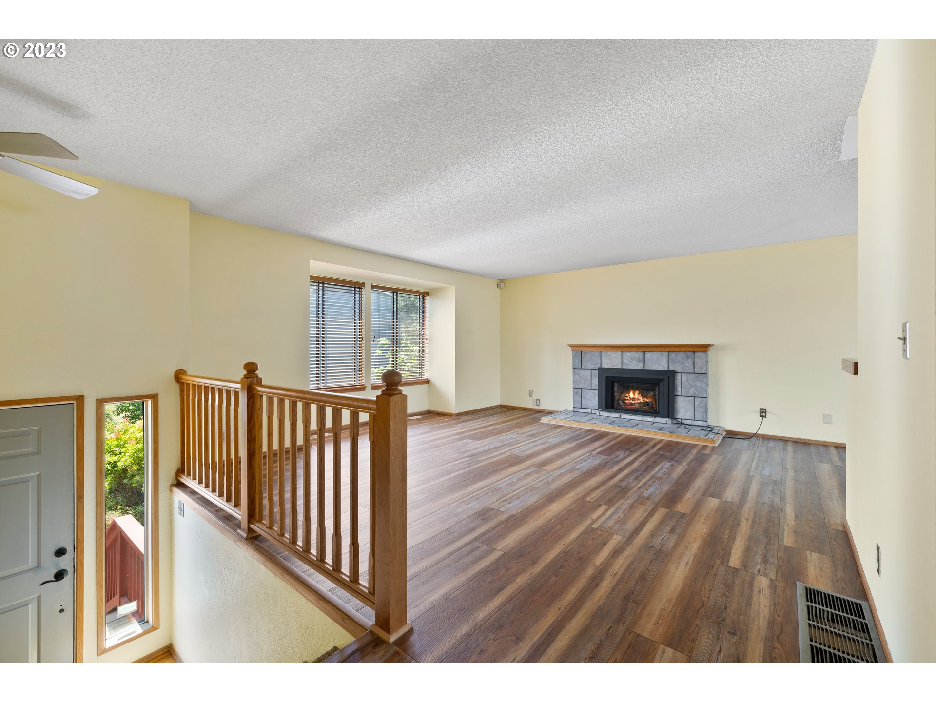 1757 Southwest 19th Court Gresham, OR 97080 - Photo 7 of 31 a view interior of a house with wooden floor and fireplace