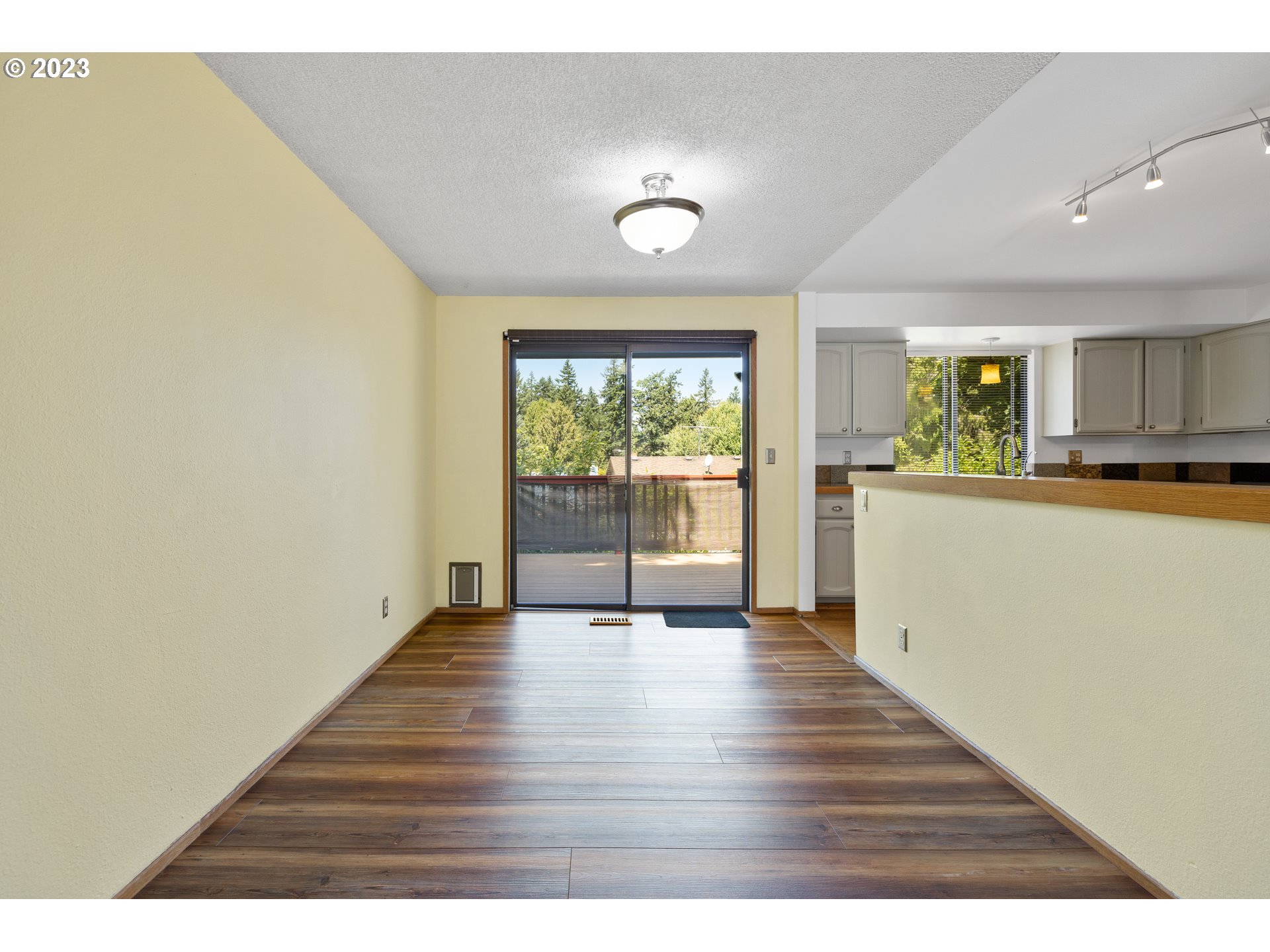1757 Southwest 19th Court Gresham, OR 97080 - Photo 9 of 31 a view of a kitchen with wooden floor and a window