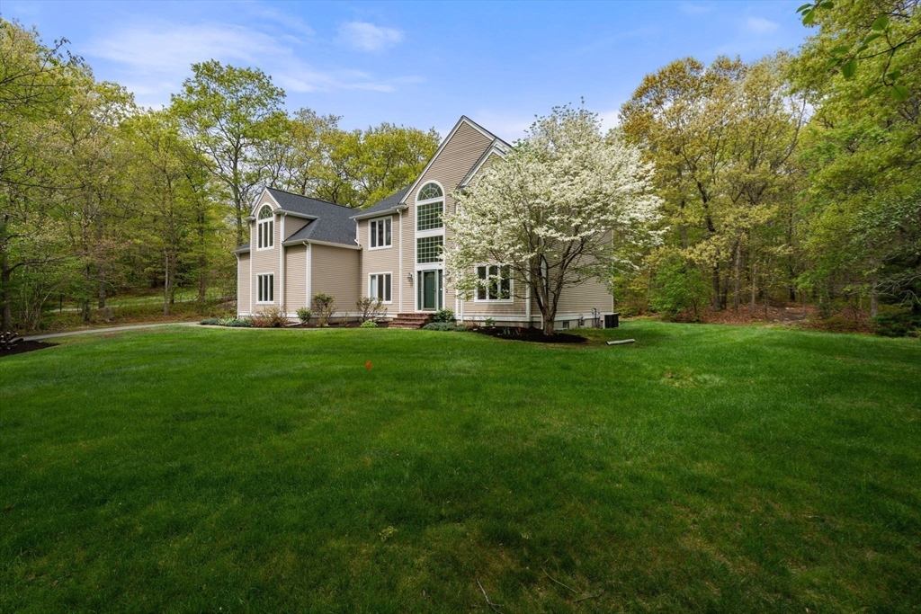 11 Black Elk Road Sharon, MA 02067 - Photo 27 of 28 a front view of a house with a garden