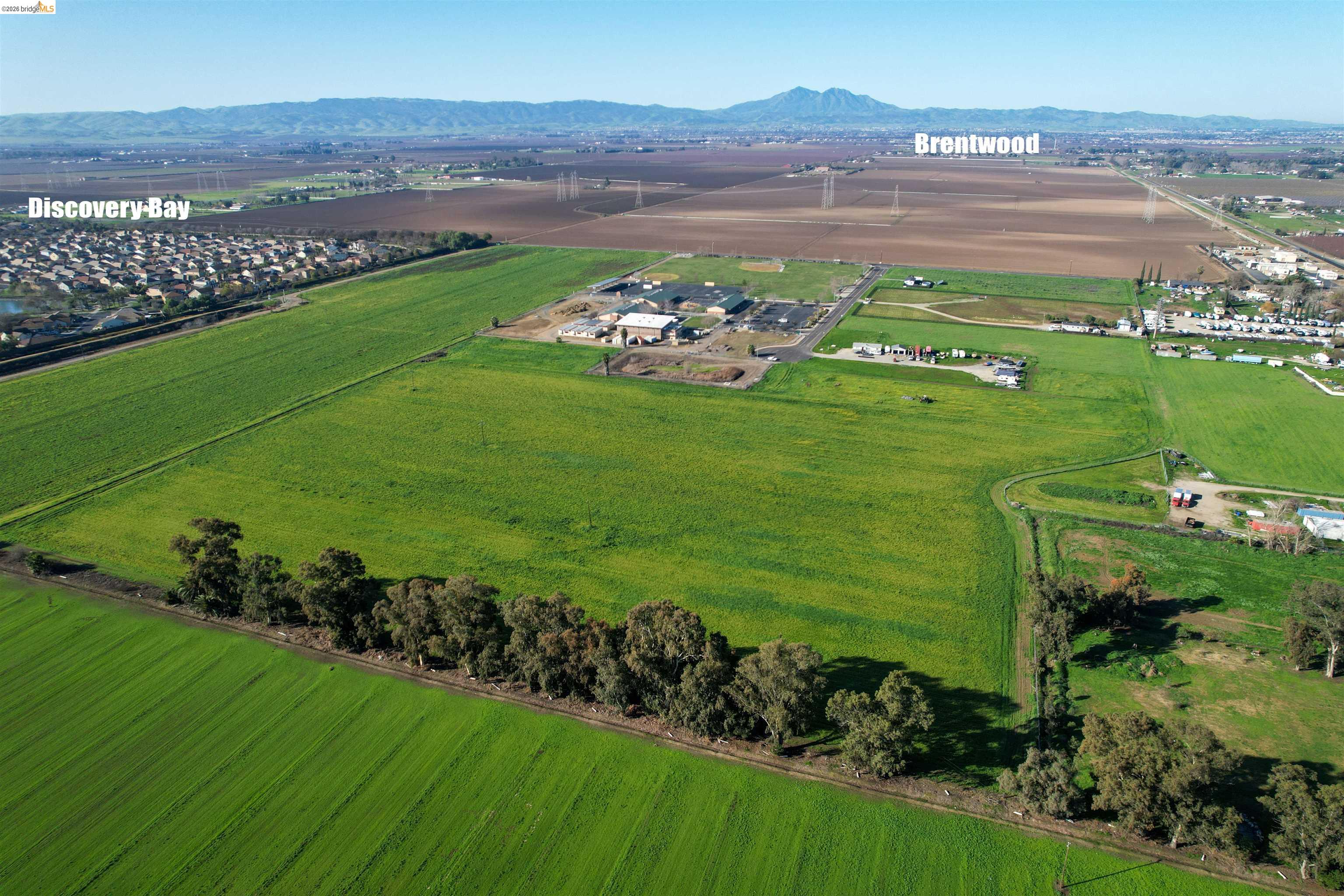 0 Learning Tree Lane Brentwood, CA 94513 - Photo 11 of 18 a view of a field with an ocean and mountain view