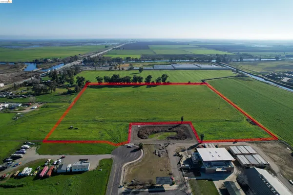 an aerial view of a golf course with chairs