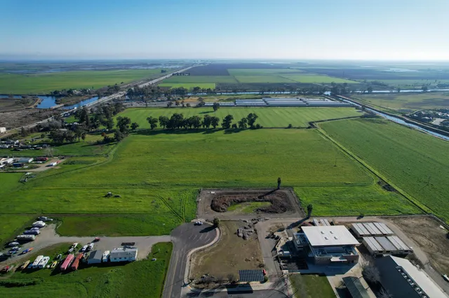 an aerial view of a golf course with chairs