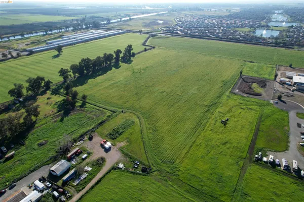 an aerial view of a houses with outdoor space