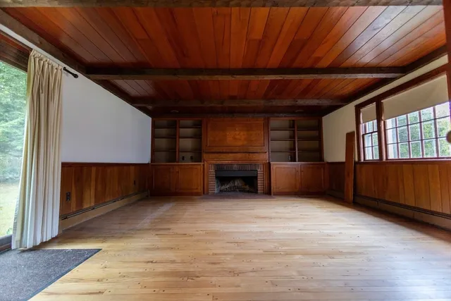 a view of an empty room with cabinet