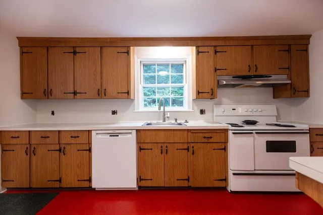 a kitchen with a stove and a sink