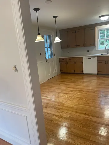 a view of a kitchen with a sink and dishwasher