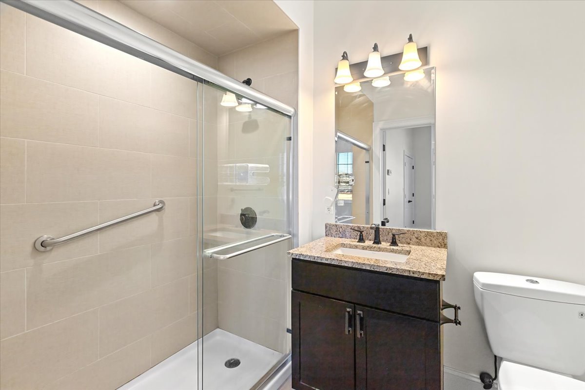 2500 Green Bay Road, Unit 202 Evanston, IL 60201 - Photo 9 of 10 a bathroom with a sink a toilet a mirror and shower