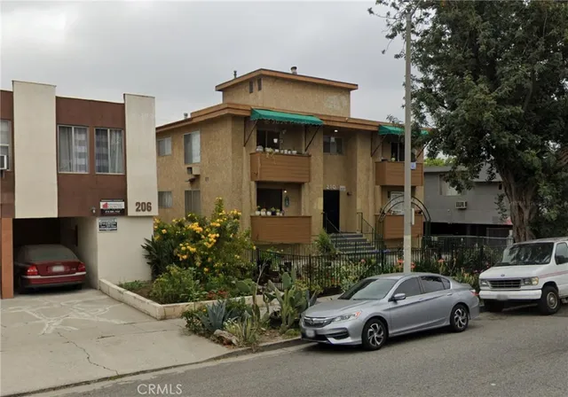 a view of a car parked in front of a house