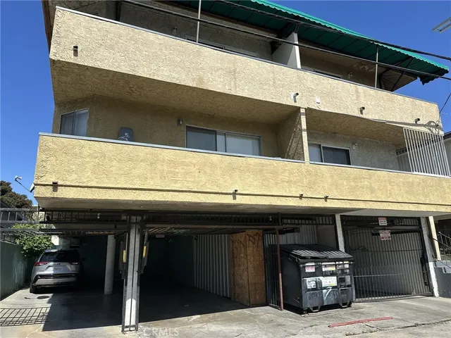 a close view of a car park in front of a building
