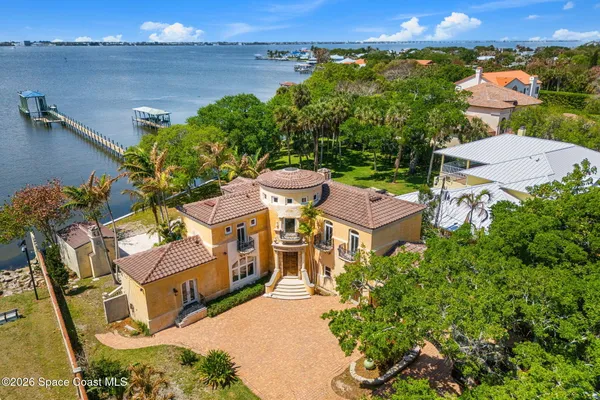 an aerial view of a house with outdoor space