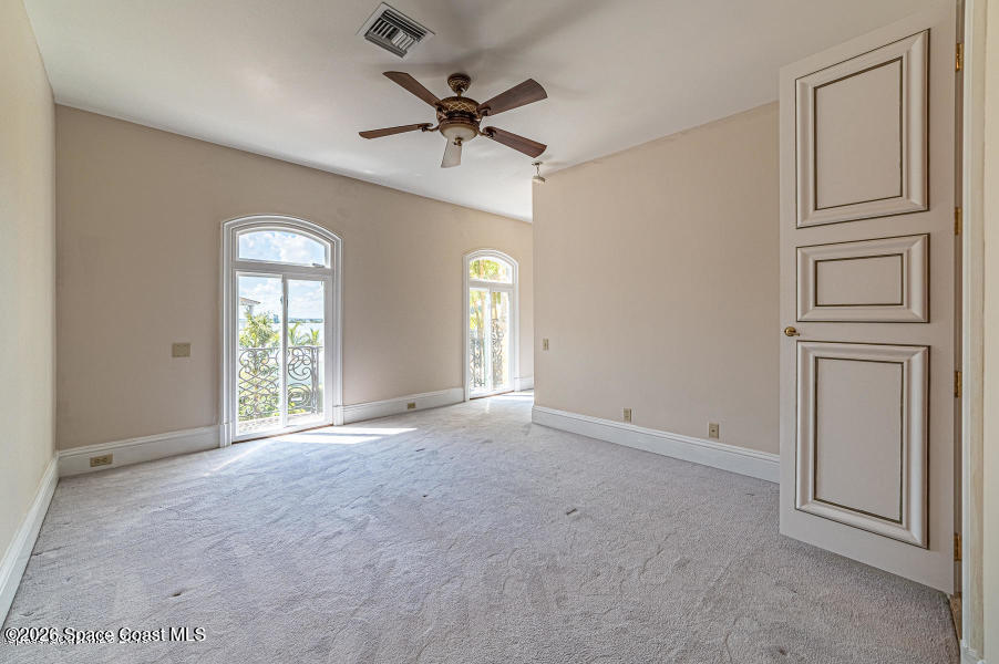 1000 North Riverside Drive Indialantic, FL 32903 - Photo 79 of 91 a view of a livingroom with a ceiling fan and window