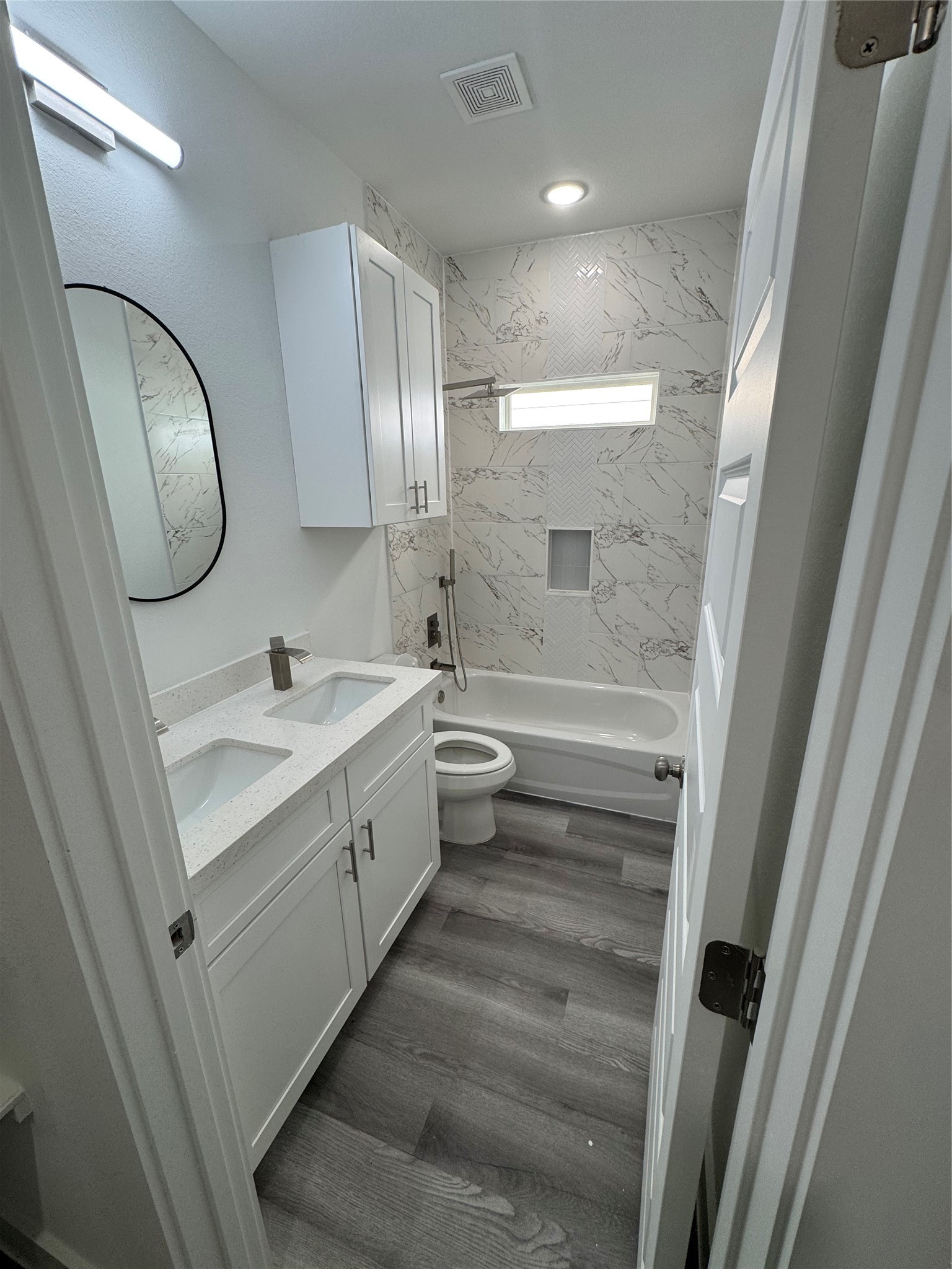 4604 Bricker Street, Unit A Houston, TX 77051 - Photo 7 of 15 a bathroom with a double vanity sink mirror and toilet