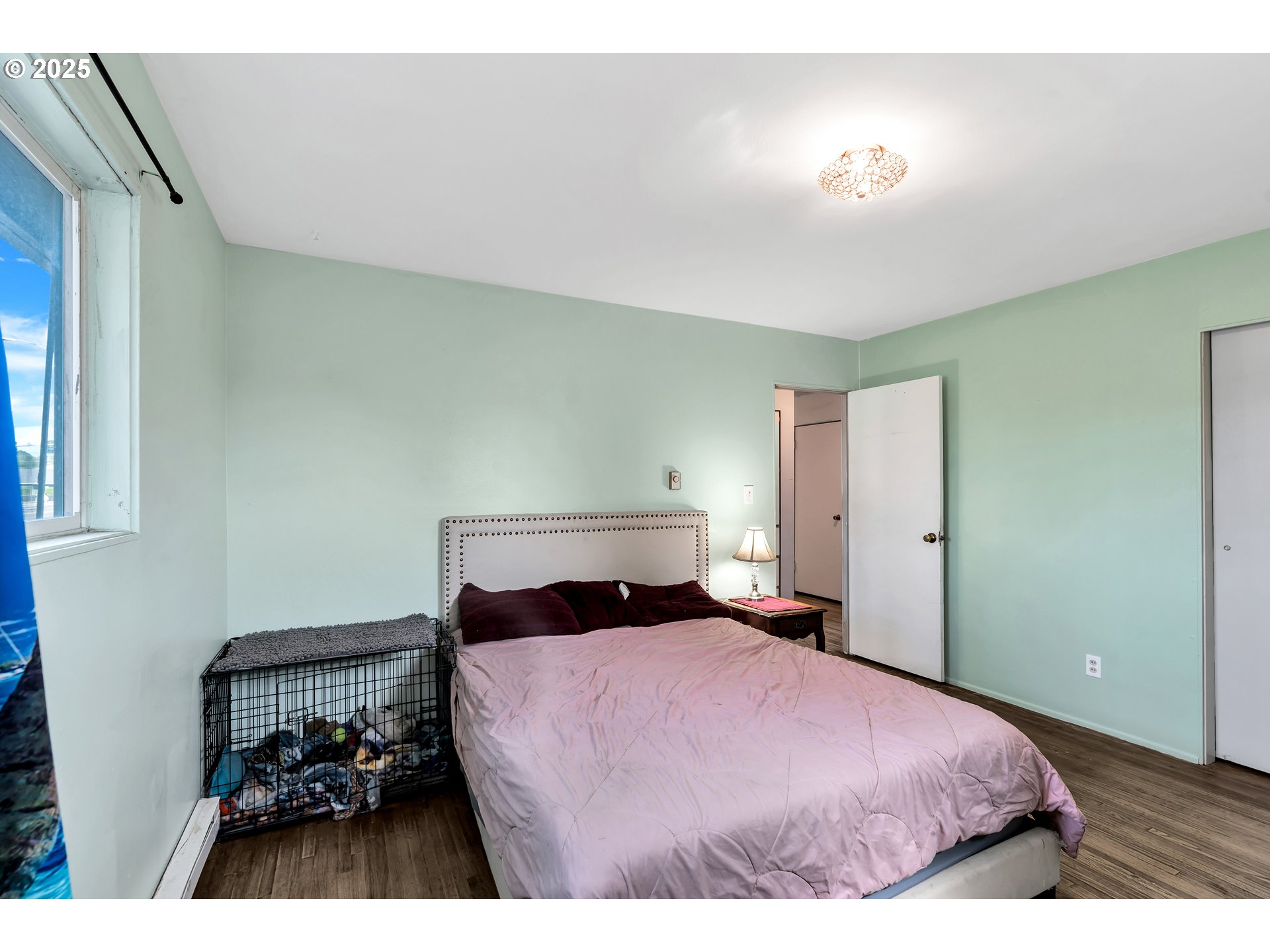 2951 Douglas Street Longview, WA 98632 - Photo 14 of 25 a bedroom with a bed and a lamp with window