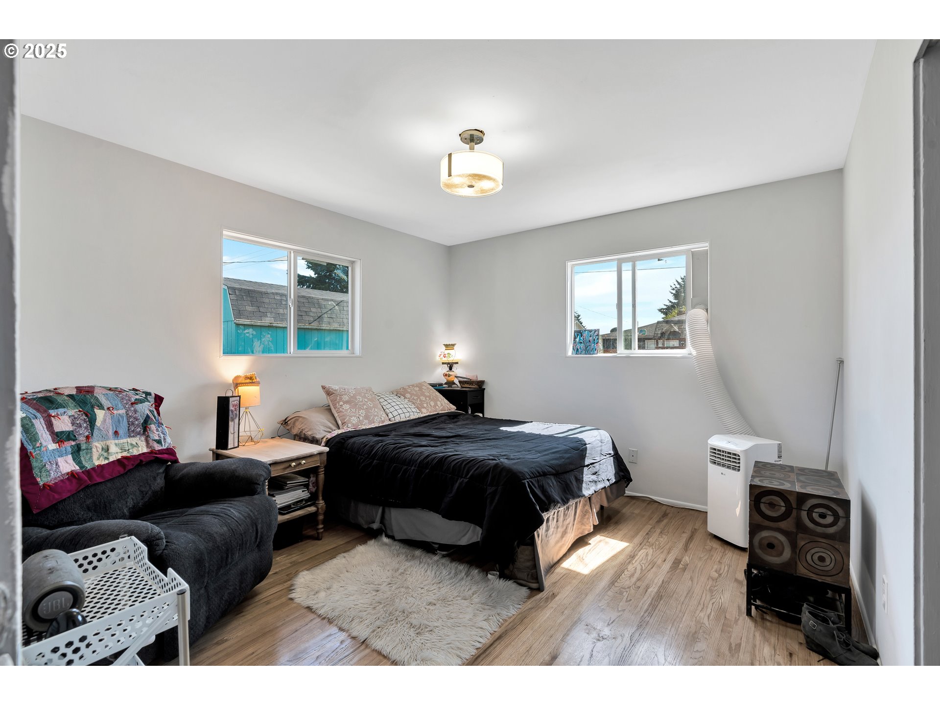 2951 Douglas Street Longview, WA 98632 - Photo 18 of 25 a bedroom with a bed window and a couch