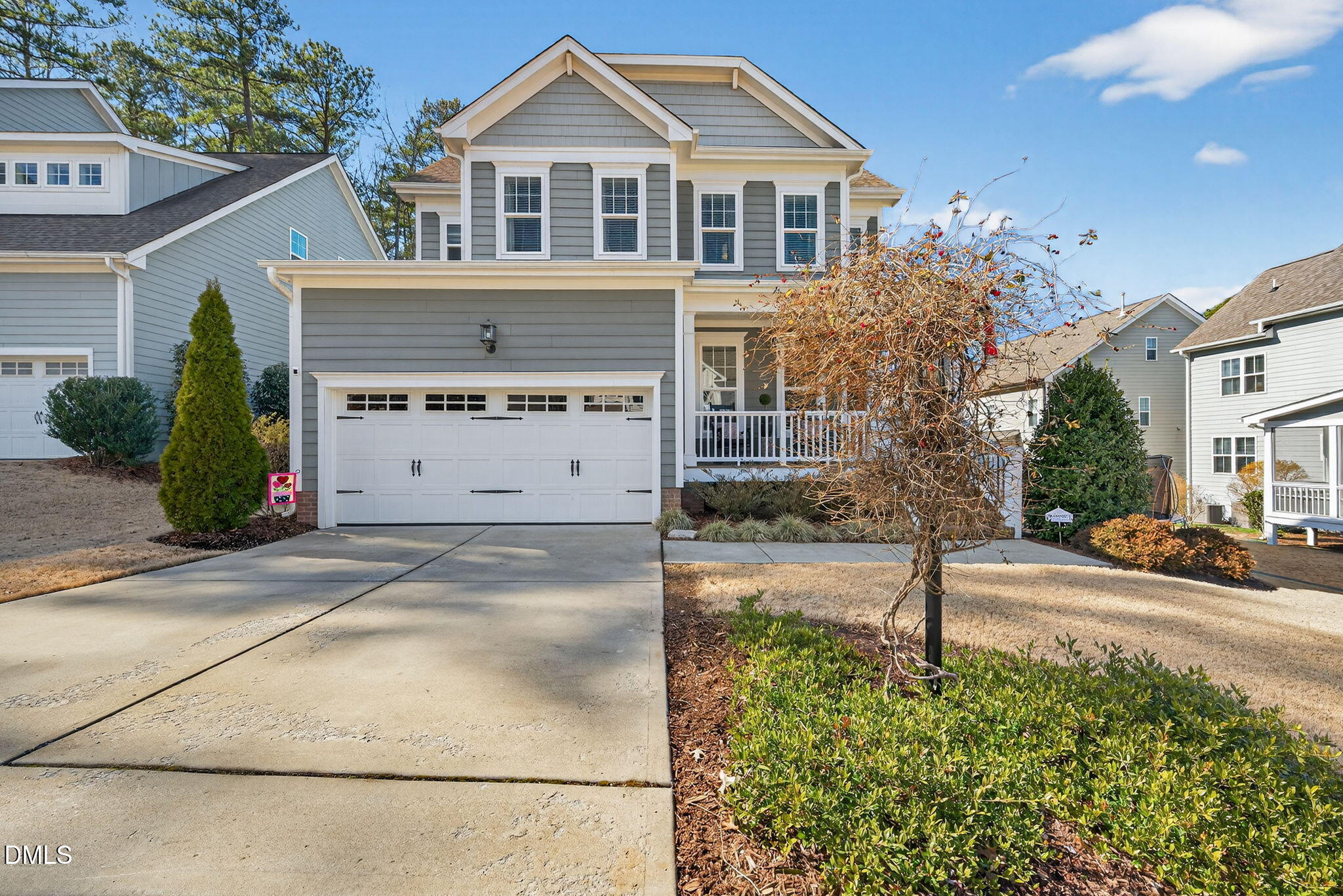 10009 Leesville Grove Drive Raleigh, NC 27613 - Photo 1 of 66 a front view of a house with a yard