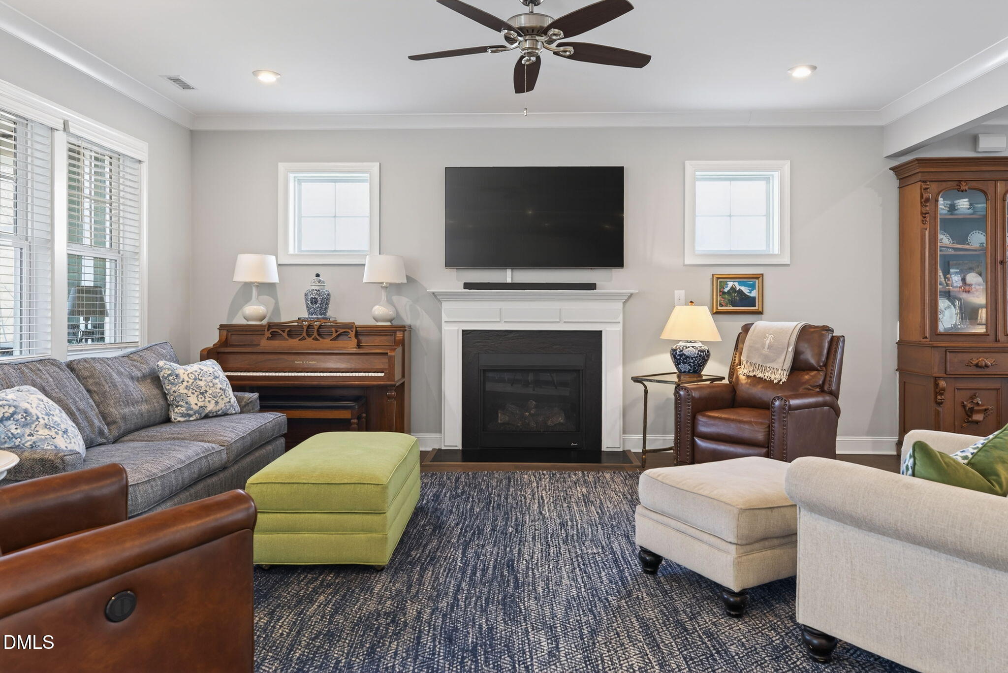 10009 Leesville Grove Drive Raleigh, NC 27613 - Photo 13 of 66 a living room with furniture fireplace and flat screen tv