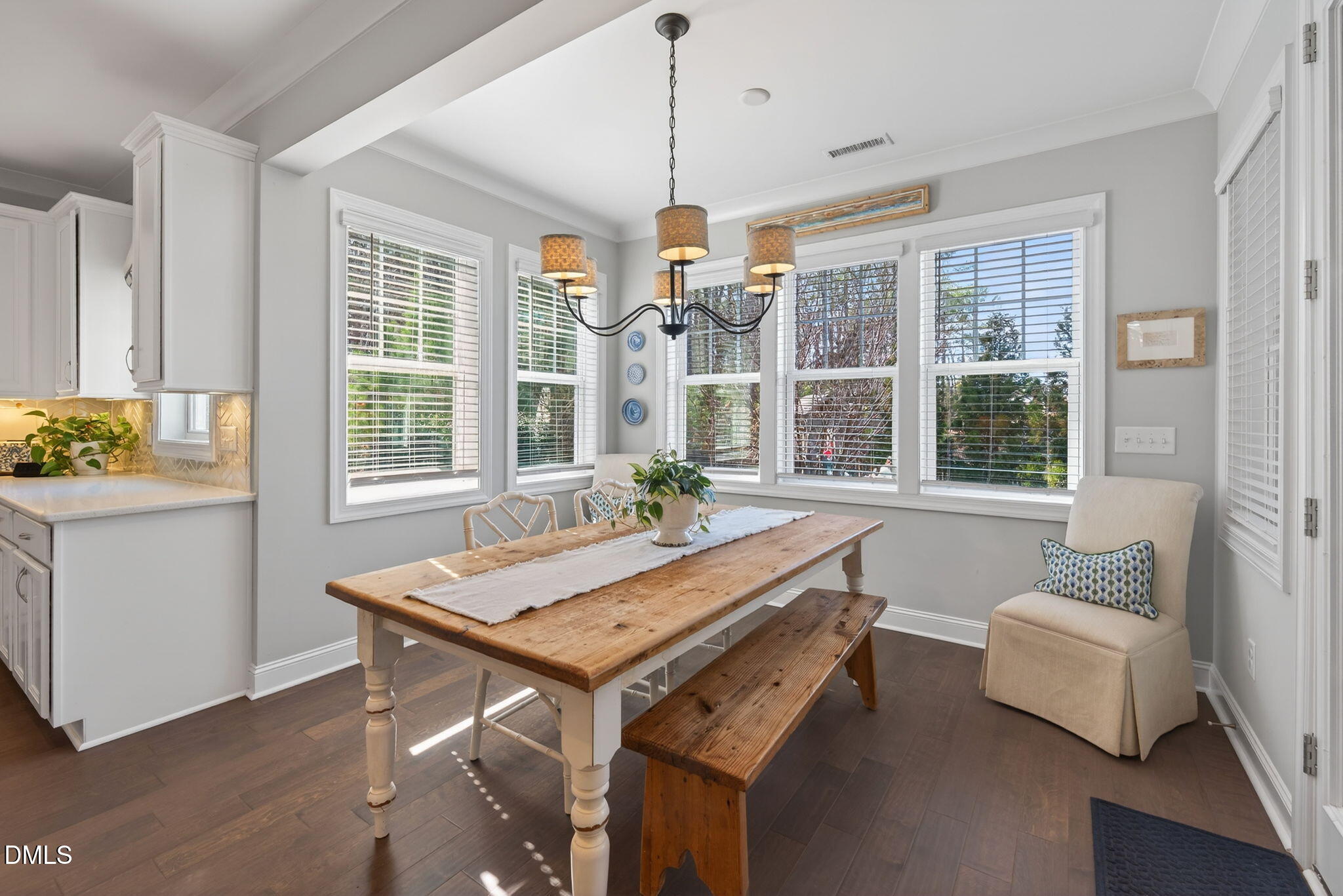 10009 Leesville Grove Drive Raleigh, NC 27613 - Photo 15 of 66 a room with chandelier furniture and windows