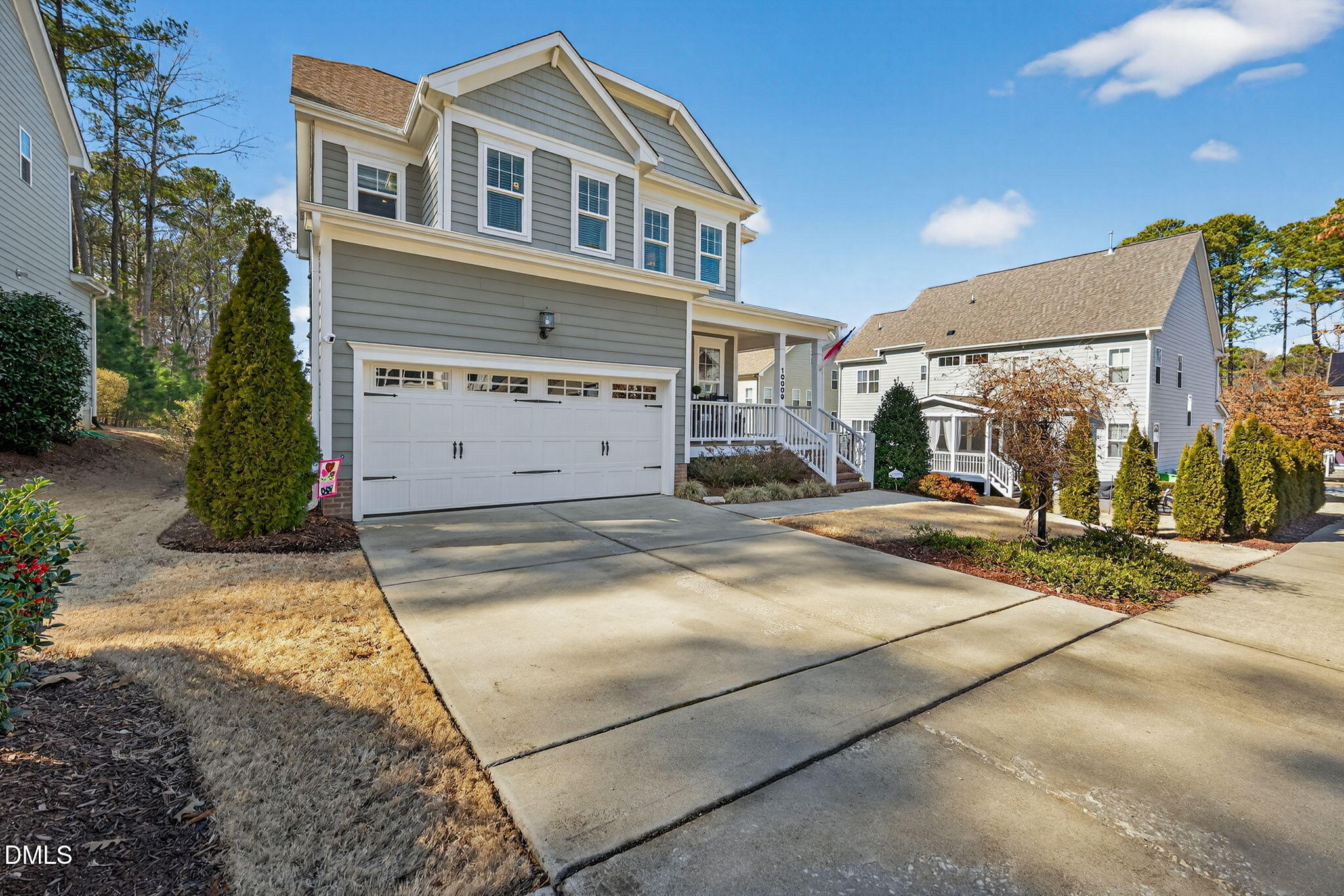 10009 Leesville Grove Drive Raleigh, NC 27613 - Photo 2 of 66 a front view of a house with a yard