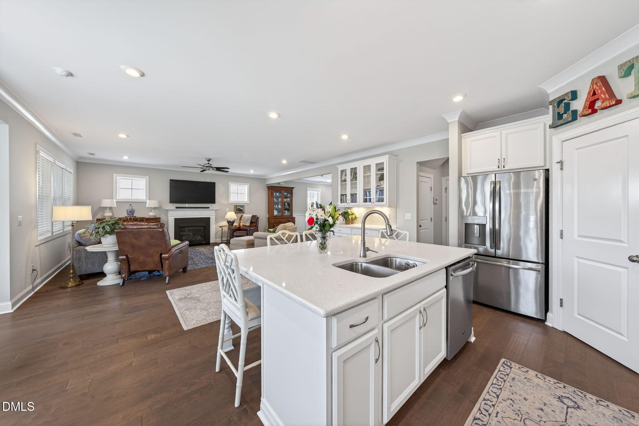 10009 Leesville Grove Drive Raleigh, NC 27613 - Photo 23 of 66 a kitchen with stainless steel appliances kitchen island granite countertop a sink refrigerator and cabinets