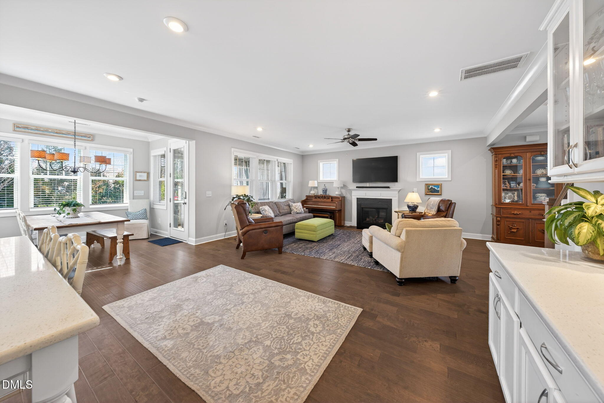 10009 Leesville Grove Drive Raleigh, NC 27613 - Photo 27 of 66 a living room with furniture and a flat screen tv