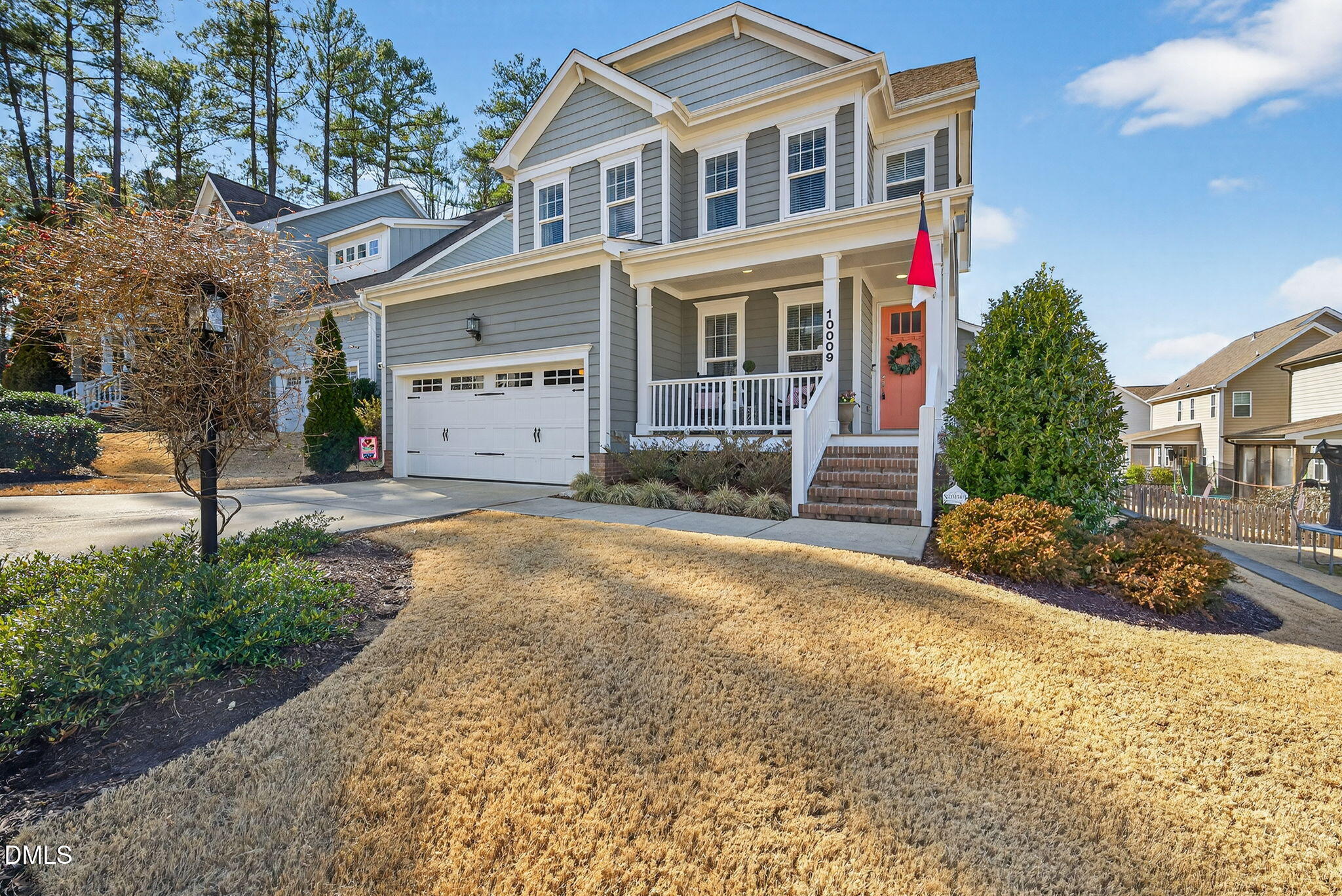 10009 Leesville Grove Drive Raleigh, NC 27613 - Photo 3 of 66 a front view of a house with a yard
