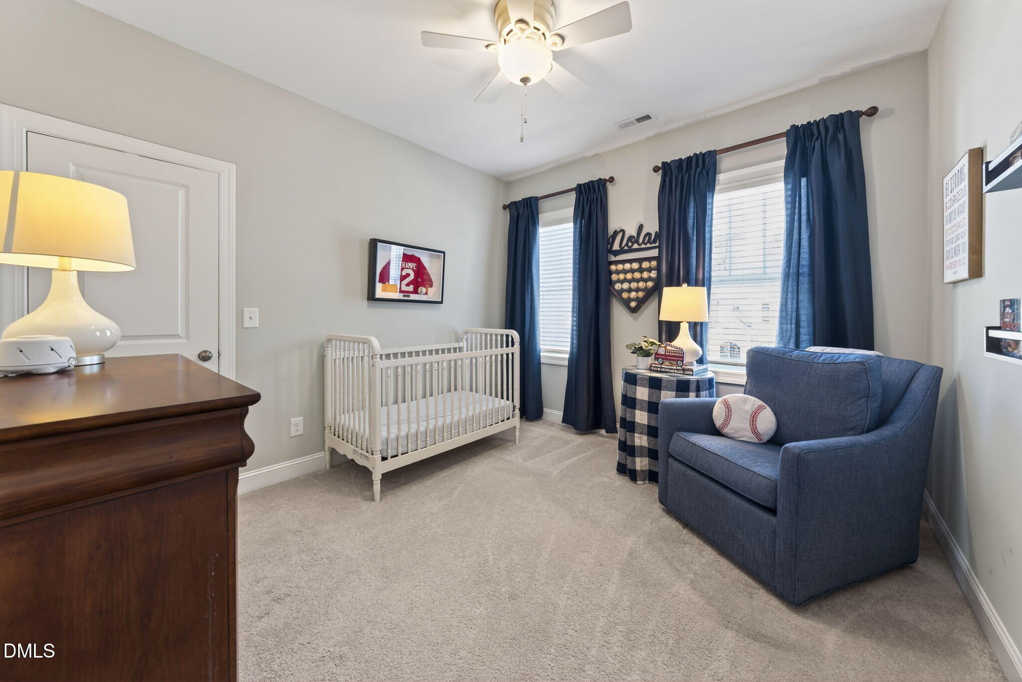 10009 Leesville Grove Drive Raleigh, NC 27613 - Photo 39 of 66 a living room with furniture and a lamp