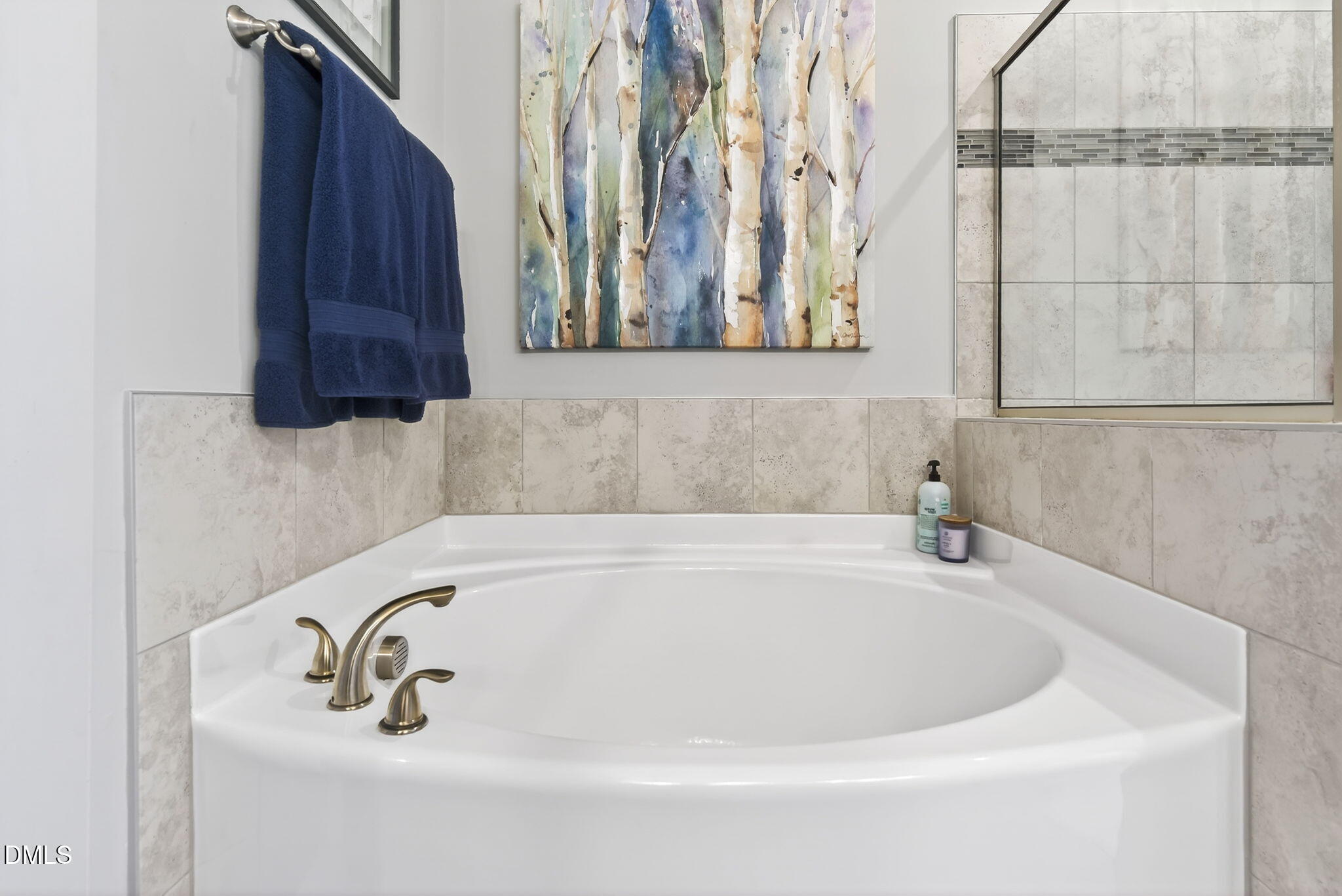 10009 Leesville Grove Drive Raleigh, NC 27613 - Photo 49 of 66 a white bath tub sitting next to a white sink