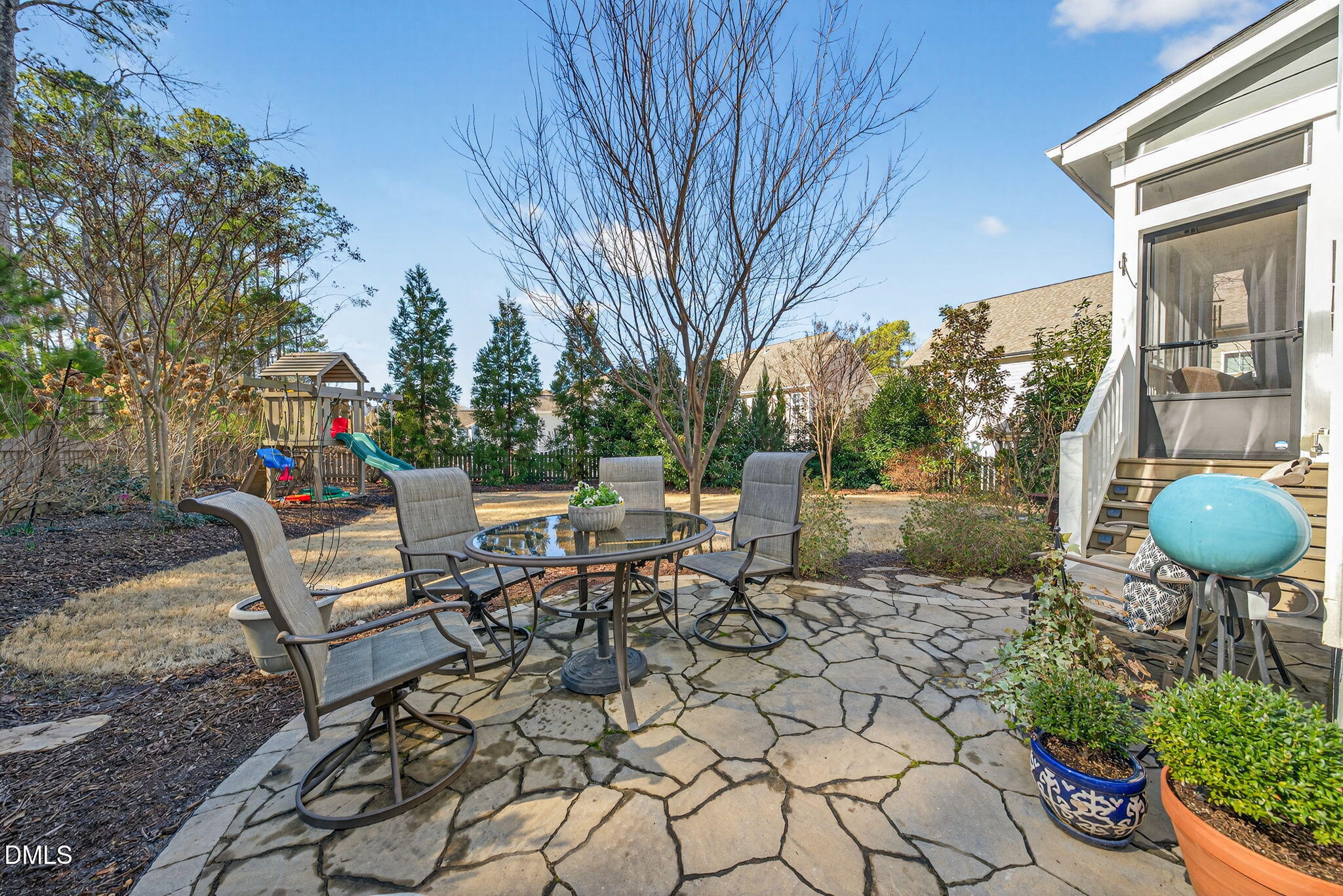 10009 Leesville Grove Drive Raleigh, NC 27613 - Photo 53 of 66 a view of a chairs and table in backyard of the house