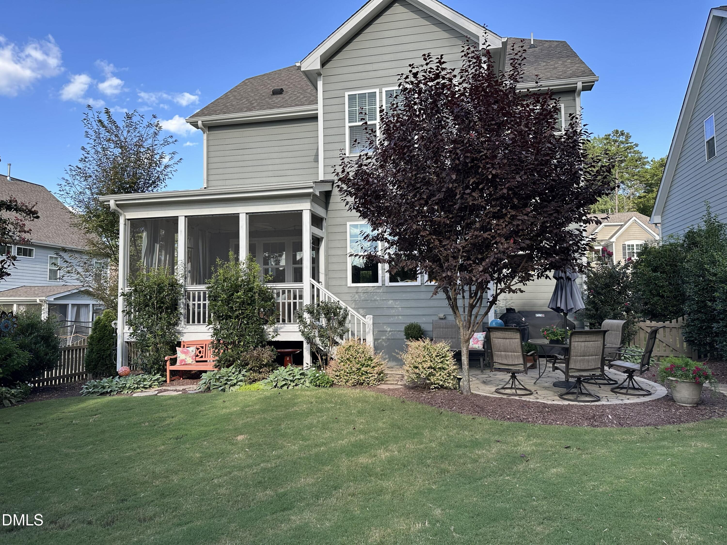 10009 Leesville Grove Drive Raleigh, NC 27613 - Photo 58 of 66 a view of a house with backyard and sitting area