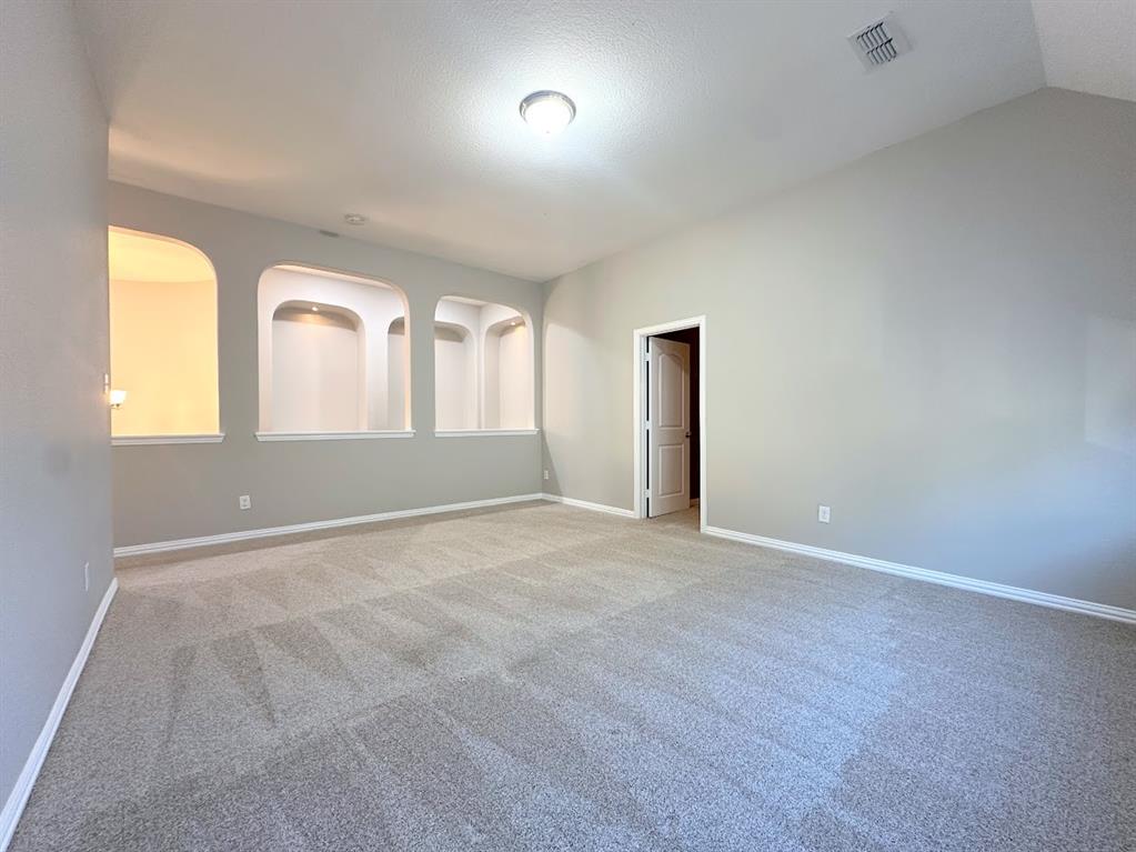 2453 Ranchview Drive Little Elm, TX 75068 - Photo 15 of 22 an empty room with windows and mirror
