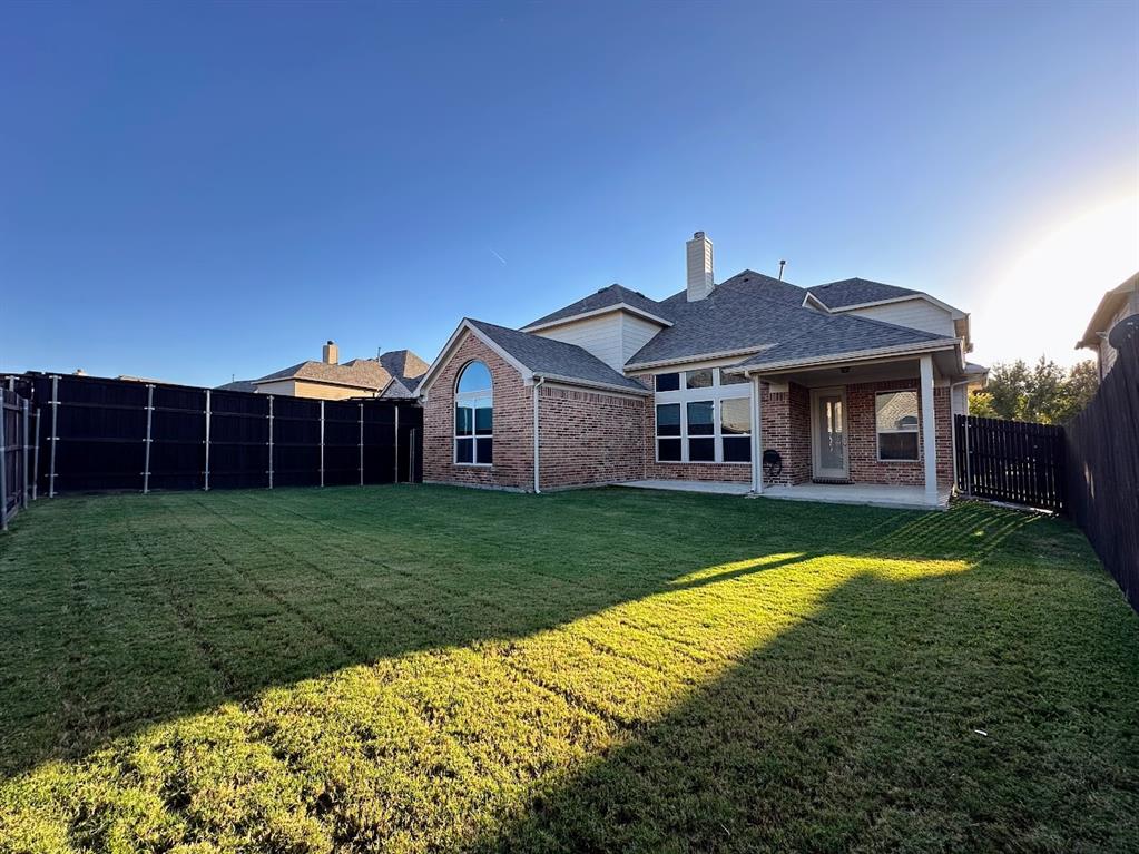 2453 Ranchview Drive Little Elm, TX 75068 - Photo 21 of 22 a front view of a house with a yard