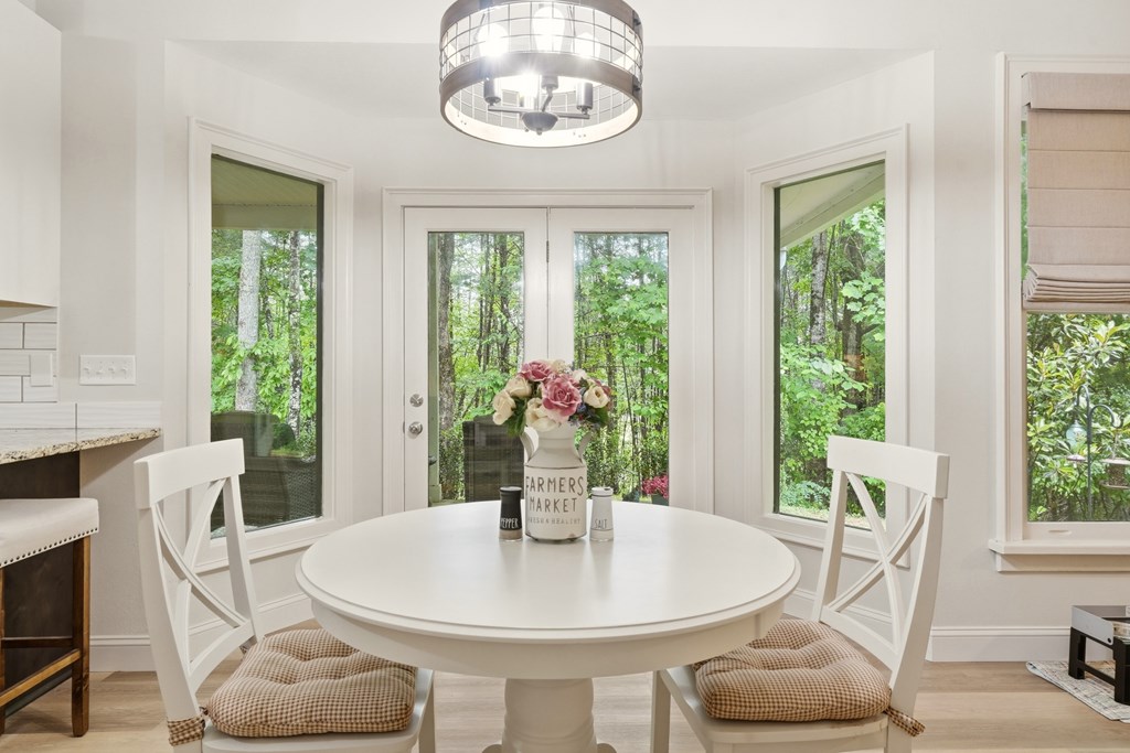175 Crane Creek Road Young Harris, GA 30582 - Photo 13 of 40 a view of a dining room with furniture window and outside view